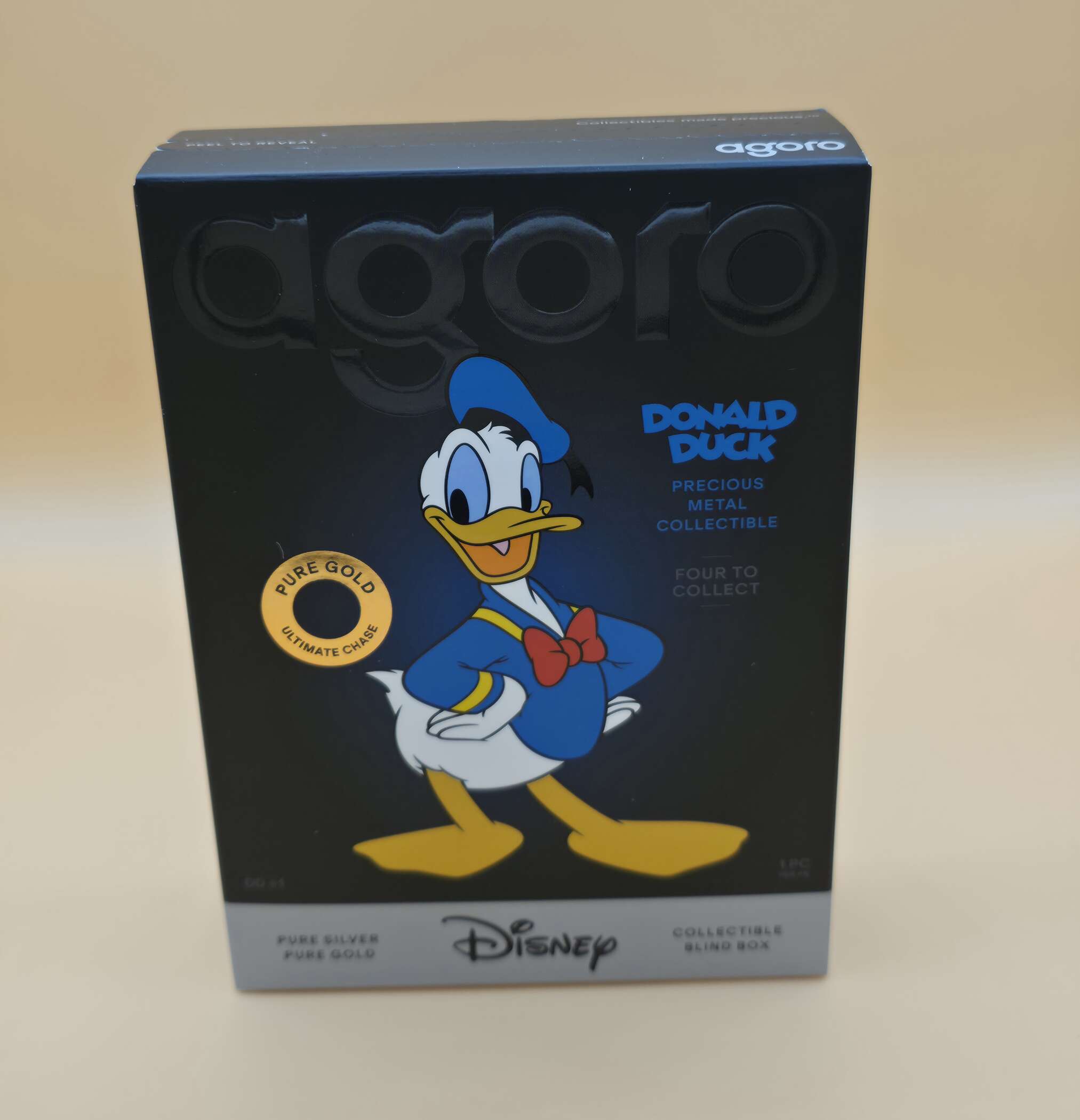 Disney Donald Duck Precious Metal Collectible Blind Box von Agoro mit vier möglichen Edelmetall‑Varianten.