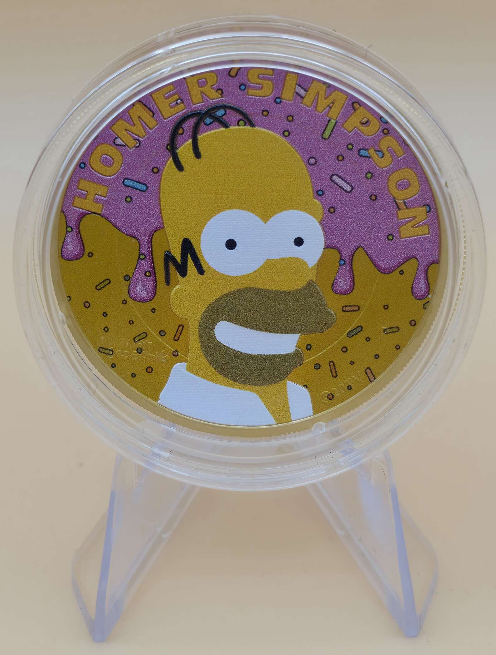 „Homer Simpson 1 oz Silbermünze 2022 im Donut‑Design“