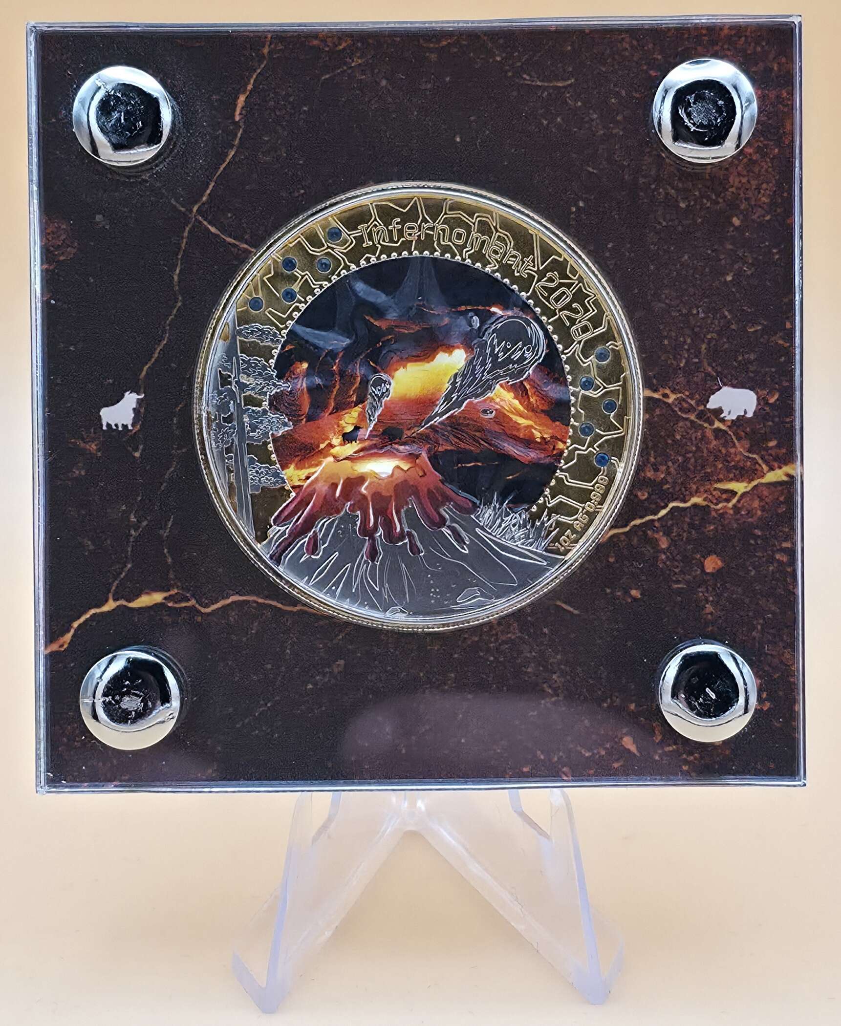 1 oz Silbermünze „InfernoBlaze / Infernomant“ aus Ghana mit Gold‑ & Palladium‑Veredelung und Hauyn‑Edelsteinen in Präsentationsbox.