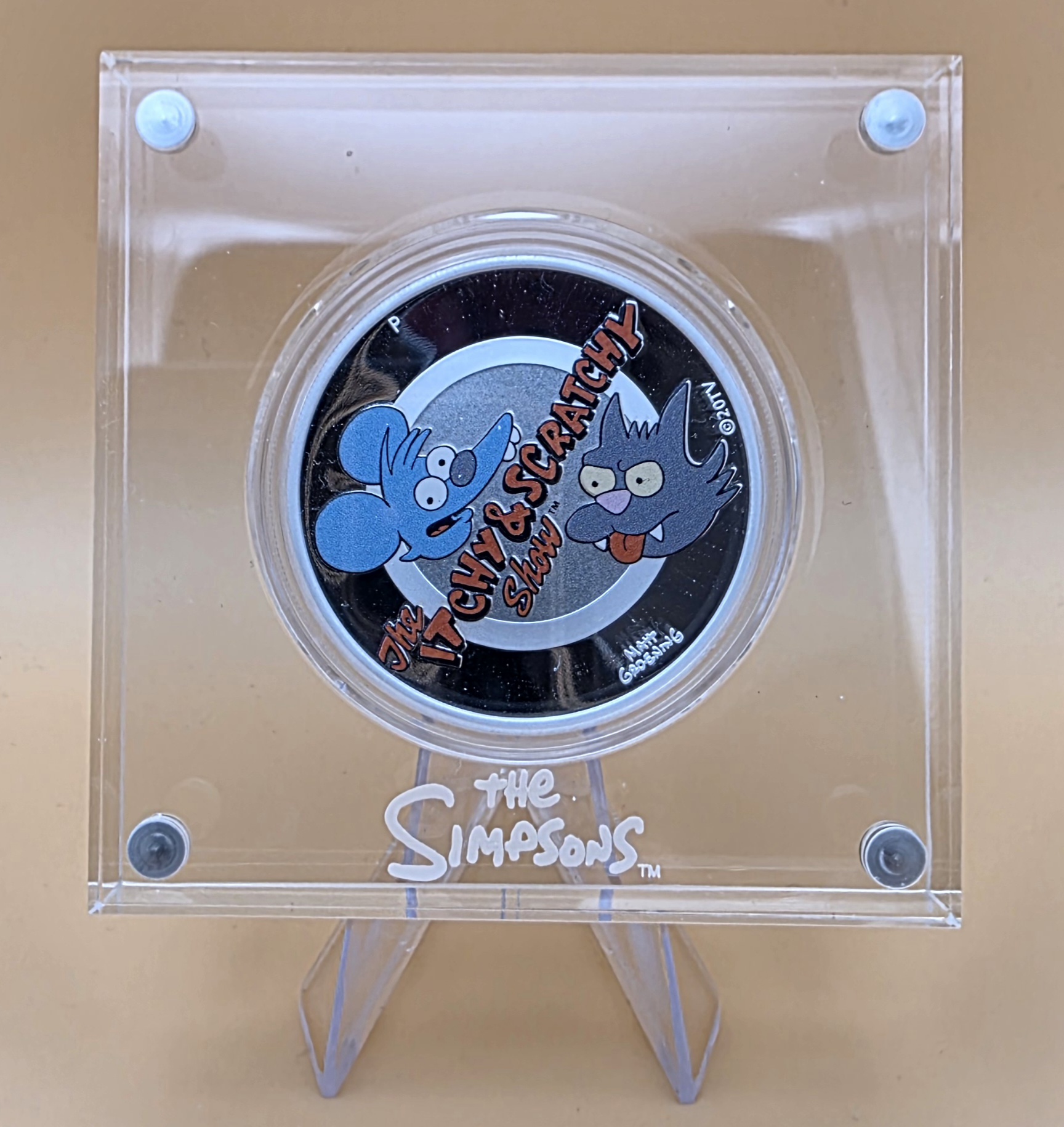 1 oz Silbermünze 2021 The Simpsons Itchy & Scratchy, Proof Colour, Perth Mint, Zertifikat 0333, Acryl‑Displaybox.